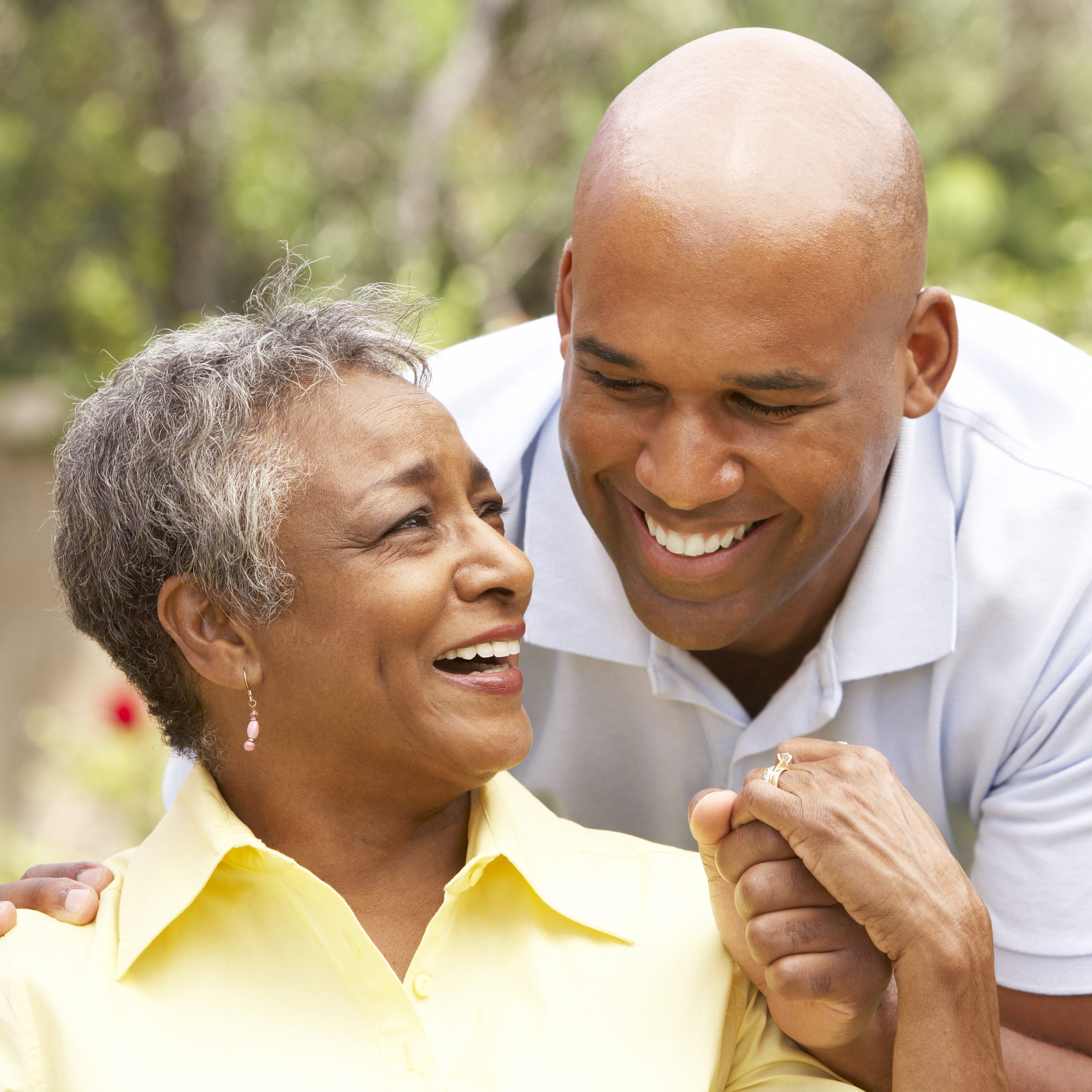 senior woman and adult son joyful