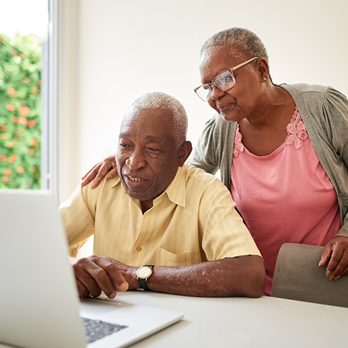 couple-looking-at-laptop